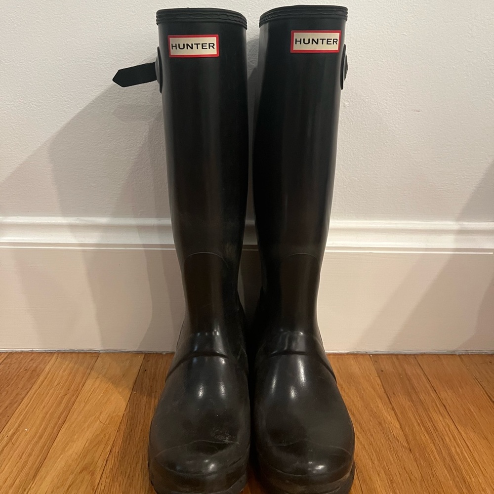 Tall black hunter boots